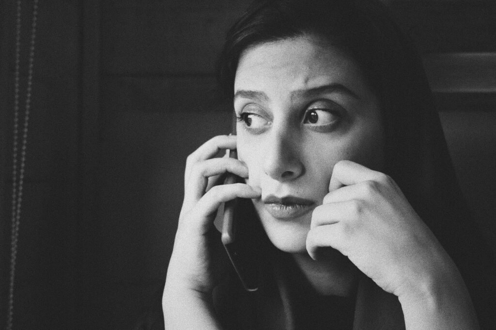 Concerned woman on the phone.